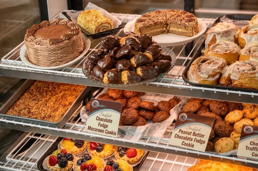 Shelves of homemade cakes, brownies, cookies and tarts inside the display case